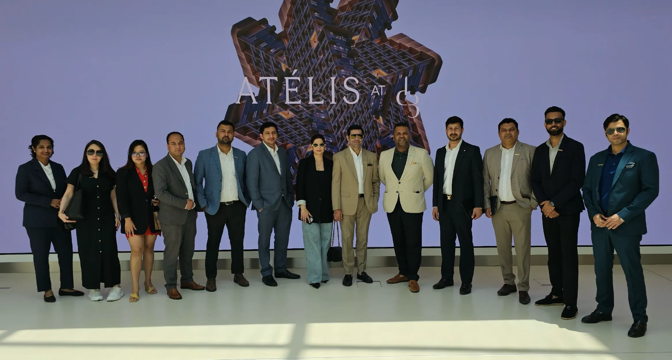 Group of men in formal suits holding awards and certificates